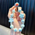 Cute light blue beaded phone strap with iridescent flower charms and round beads - Blue
