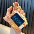 Portable brown TV-shaped mini LCD writing tablet keychain with cute Capybara design - Orange Style