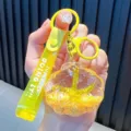 Vibrant gelber Muschel-Schlüsselanhänger mit glitzerndem Seestern und Handschlaufe - Gelbe Seestern Muschel
