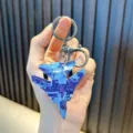 Blue camouflage fighter jet keychain with pull-back wheels and durable metal clip - Blue