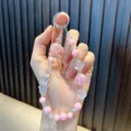 Roze en transparante kralen telefoonkoord met sterretjes en glitterbollen voor sleutels - Roze