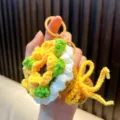 Hand-crocheted flower bouquet keychain featuring vibrant yellow and green wool yarn - Yellow