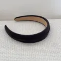 Detailed view of black padded headband featuring a thick ribbed texture - Grey Headband