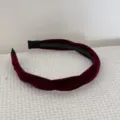 Elegant wine red velvet twisted headband showing rich fabric texture and inner teeth. - Red Velvet Headband
