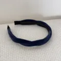 Close-up view of a dark blue braided velvet headband with elegant soft fabric texture. - Dark Blue Velvet Headband