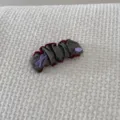 Close-up view of vintage grey fabric scrunchie with burgundy ruffles and handmade tag. - Gray Snap Clip (FJ83662)