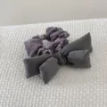 Close-up of a vintage purple floral scrunchie with a large charcoal gray fabric bow - Gray Bowknot Scrunchie (FJ83662)
