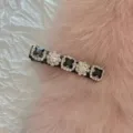 Close-up of a Korean style rhinestone duckbill hair clip featuring black square gemstones - Black Full Diamond / Black
