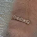 Elegant pink satin hair clip with square rhinestones shown on a soft pink fur background. - Pink Rhinestone / Pink