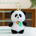 Cute panda plush toy keychain with a bell and leaf pendant, soft fluffy backpack charm. - Panda