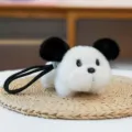 Adorable fluffy white dog plush keychain with round black ears for cute backpack decor - Prone Puppy / 14cm / White