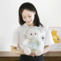 Soft white plush sheep doll wearing a light green dress and matching sun hat. - Green Skirt / 22cm