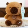 Cute brown capybara plush toy with decorative neck tag and heart foot embroidery - Capybara / 16cm