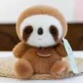 Adorable fluffy brown sloth plush toy sitting on a straw mat with heart embroidery details - Sloth / 16cm