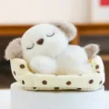 Adorable sleeping plush dog toy nestled in a polka dot bed for desk decor - Dog / 16cm
