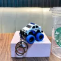 Miniature white and blue police car toy keychain with pull-back off-road vehicle design - Police Style / White (Police Car)