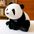 Adorable lifelike plush panda stuffed animal sitting on a white textured surface for kids - 30cm Size / Panda