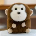 Adorabile peluche a forma di scimmia sferica con morbida pelliccia marrone e crema - Monkey