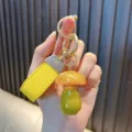 Handcrafted cute resin mushroom keychain with glitter finish and yellow leather strap accessory - Yellow Mushroom