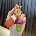 Cute purple and green glitter resin mushroom keychain with textured orange leather strap - Mushroom / Purple