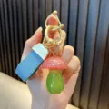 Glittery red and green mushroom resin keychain pendant with blue textured leather strap - Mushroom / Pink