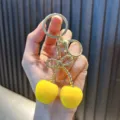 Cute yellow sugar orange fruit resin keychain with premium golden metal bow detail - Cherry / Yellow