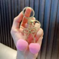 Exquisite pink flocked cherry keychain with golden metallic bow and lobster clasp for keys - Cherry / Pink