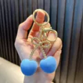 Exquisite cute blue velvet fuzzy cherry keychain with golden bow charm and lobster clasp. - Cherry / Blue