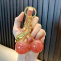 Exquisite glittery red resin cherry keychain with gold-tone leaf and sturdy metal ring - Cherry (Fine Glitter) / Deep Pink