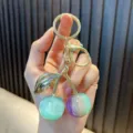 Cute resin cherry keychain with teal and purple gradient fruit charms and gold hardware - Phantom Cherry / Lake Blue
