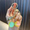 Exquisite resin cherry keychain with colorful gradient fruit charms in gold finish - Iridescent Cherry Yellow Green
