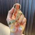 Cute pink pearlescent resin cherry keychain with elegant gold hardware for bag or car keys - Iridescent Cherry Yellow Coffee