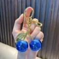 Exquisite metallic blue cherry keychain with gold finish stem and lobster clasp accessory - Glossy Cherry Blue