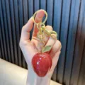 Cute resin fruit keychain with red glitter finish and gold hardware for bags - Glitter Strawberry / Transparent Red