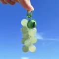 Adorable simulation green resin grape keychain featuring a matching color bell for bags - Color-Changing Grape / Green