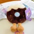 Adorable chocolate brown donut plush toy with legs, white frosting and sprinkles - Donut