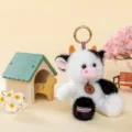 Adorable black and white fluffy plush cow keychain charm with Happy paw print tag - Cow