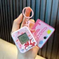 Llavero de máquina electrónica para mascotas rosa juego portátil para bolsos y niños - Rosa