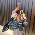 Premium mini fitness gym themed keychain featuring barbell plate and sport bottle charms - Black