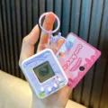 Lindo llavero de juego electrónico de mascota virtual púrpura claro con pantalla de píxeles - Púrpura