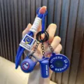 Blue fitness-themed keychain featuring mini kettlebell, shaker and barbell charms - Sapphire Blue