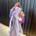 Cute purple table tennis racket keychain with lace and braided rope details - Purple