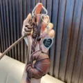 Brown leather croissant bag pendant keychain with heart photo frame and woven rope. - Coffee