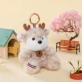Süßer Plüschtier-Schlüsselanhänger mit Rentiergeweih und Happy-Anhänger. - Hirsch