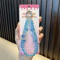 Handmade blue crystal beaded phone charm featuring a heart-shaped perfume bottle - Blue
