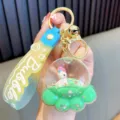 Cute oil-filled glitter keychain featuring a pony figure and a colorful Bubble strap - Green