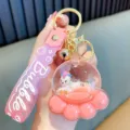 Cute pink cat paw liquid oil keychain with unicorn figure and soft silicone strap - Pink