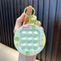 Niedlicher grüner Frosch Quick Push Fidget Toy Schlüsselanhänger zur Stressbewältigung - Grün