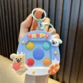 Cute animal memory game machine keychain toy with colorful pop bubbles and cartoon design. - Blue