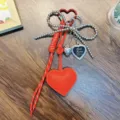 Red PU leather heart keychain featuring a silver beaded bow and heart photo frame charm - Red